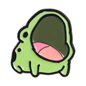 Broche en forme de grenouille verte, bouche ouverte et langue rose, sur fond blanc