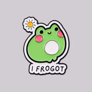 Broche grenouille verte souriante avec une petite fleur blanche et jaune
